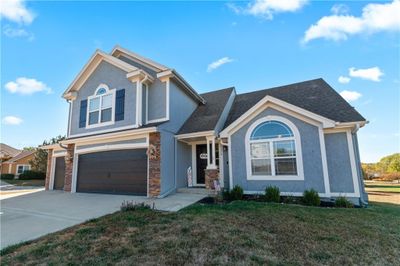 View of front of house with a front yard and a garage | Image 3