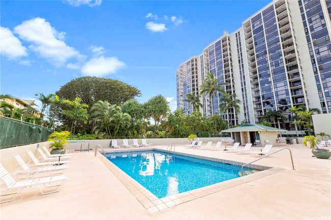 A lovely pool area, perfect for relaxing and enjoying sunny days. | Image 22