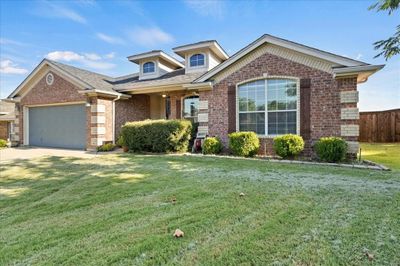 View of front of house with a front lawn and a garage | Image 3