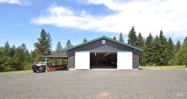 Garage with a garage and driveway | Image 26