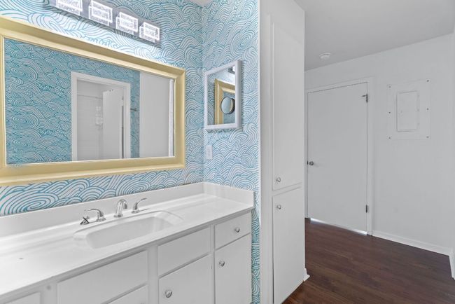 Enjoy a spacious vanity and tasteful fixtures. | Image 19