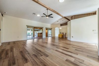 Living/Dining Room with Striking floors and Cathedral ceiling! | Image 3