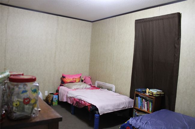 Carpeted bedroom featuring crown molding | Image 32