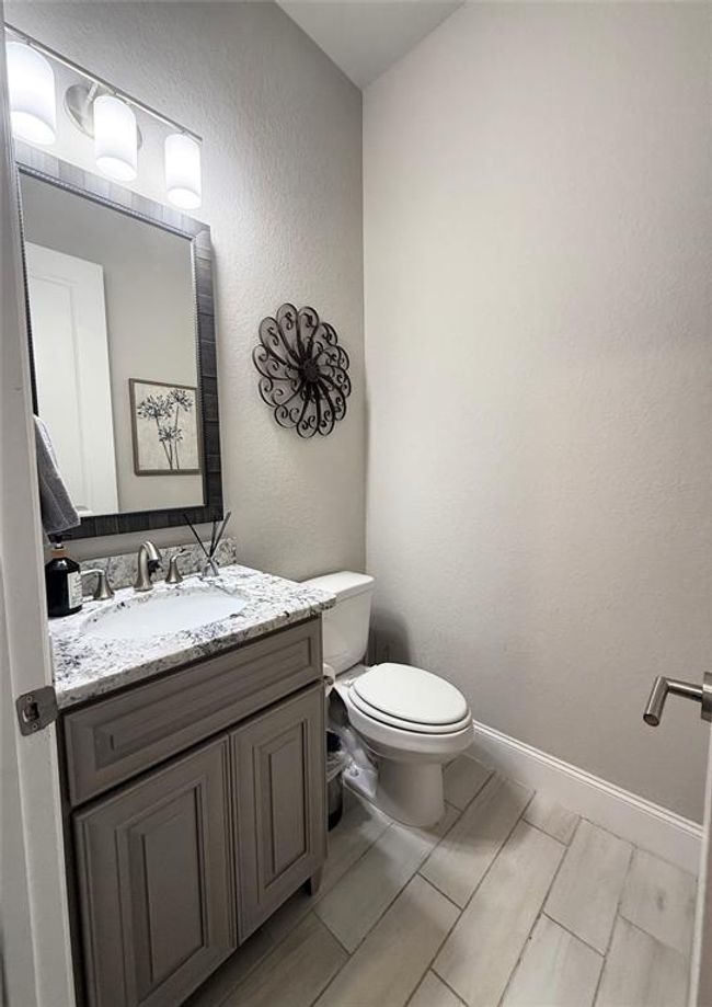 Half bath near the garage and laundry room. | Image 21