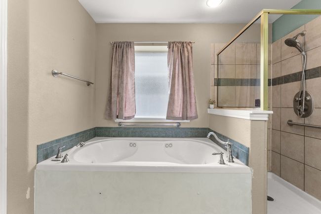 Bathroom with a bath and a shower stall | Image 20