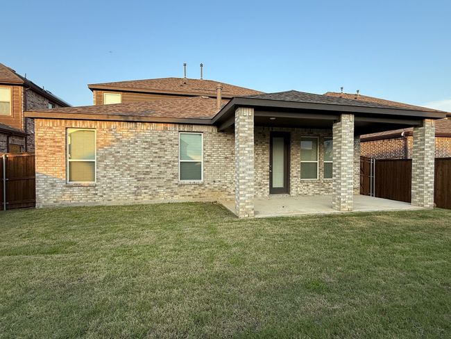 Back of house with a patio, brick siding, and a shingled roof | Image 21