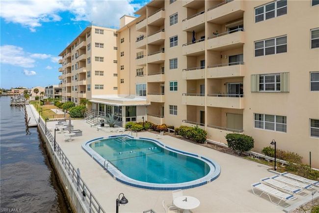 View of pool with a water view and a patio area | Image 31
