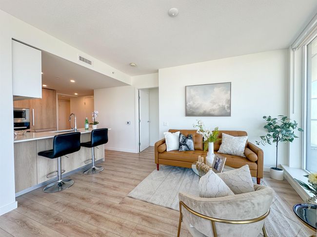Living area featuring light wood-type flooring and baseboards | Image 4