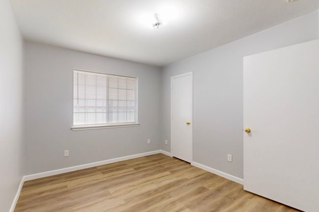 Empty room featuring light wood-style flooring and baseboards | Image 11