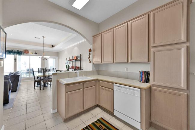 Kitchen offers plenty of counter and storage space. | Image 11
