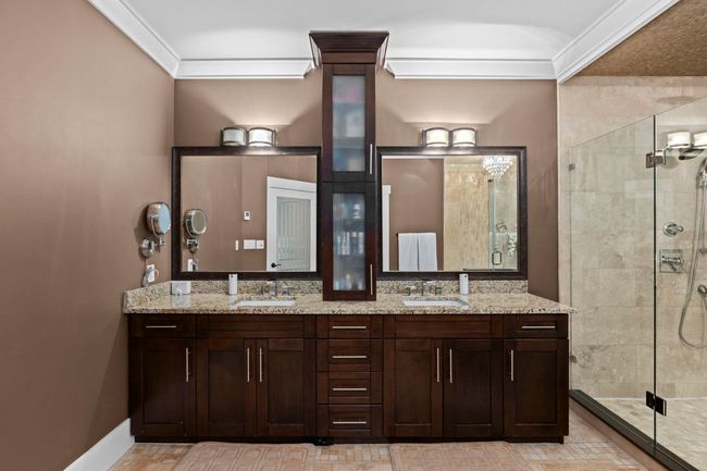 Full bathroom with a sink, ornamental molding, and a shower stall | Image 24
