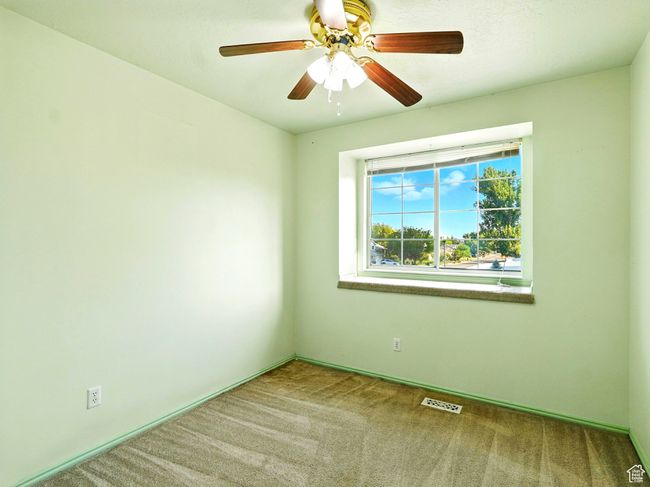 Unfurnished room with carpet flooring and a ceiling fan | Image 19