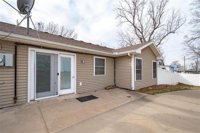 Rear view of house with a patio and fence | Image 31