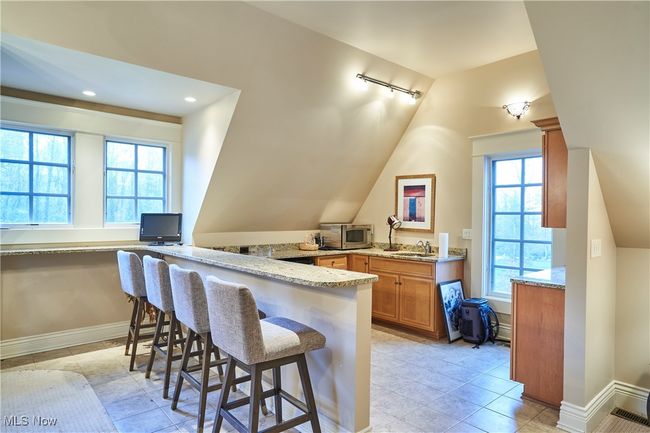 Above the garage is a 36 x 27 apartment that make a perfect guest suite, office or inlaw suite., with a kitchenette | Image 28