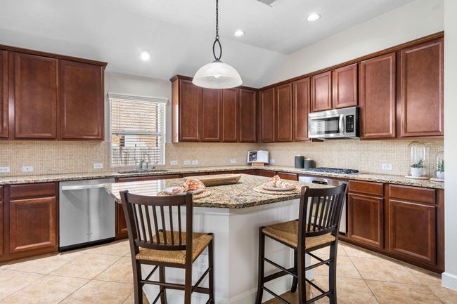 Kitchen with island and plenty of storage | Image 15