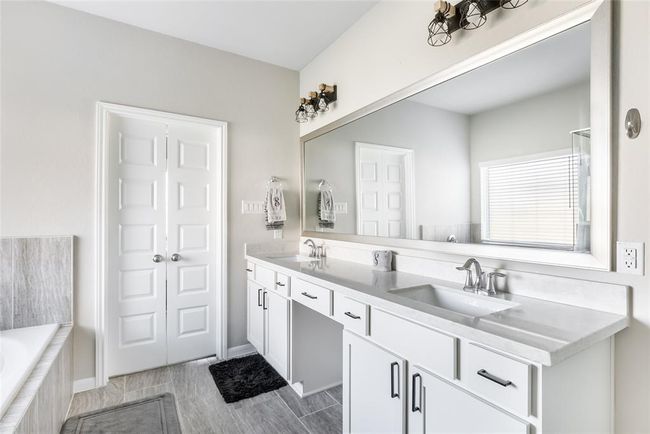 Updated decorative lighting and new hardware on cabinets recently added. | Image 23