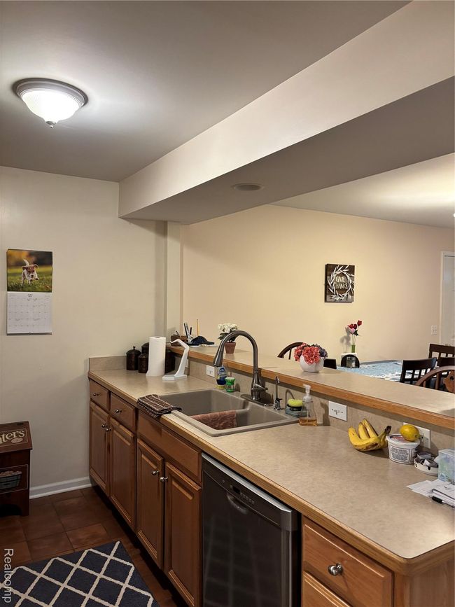 kitchen looking into living room and dining area | Image 7