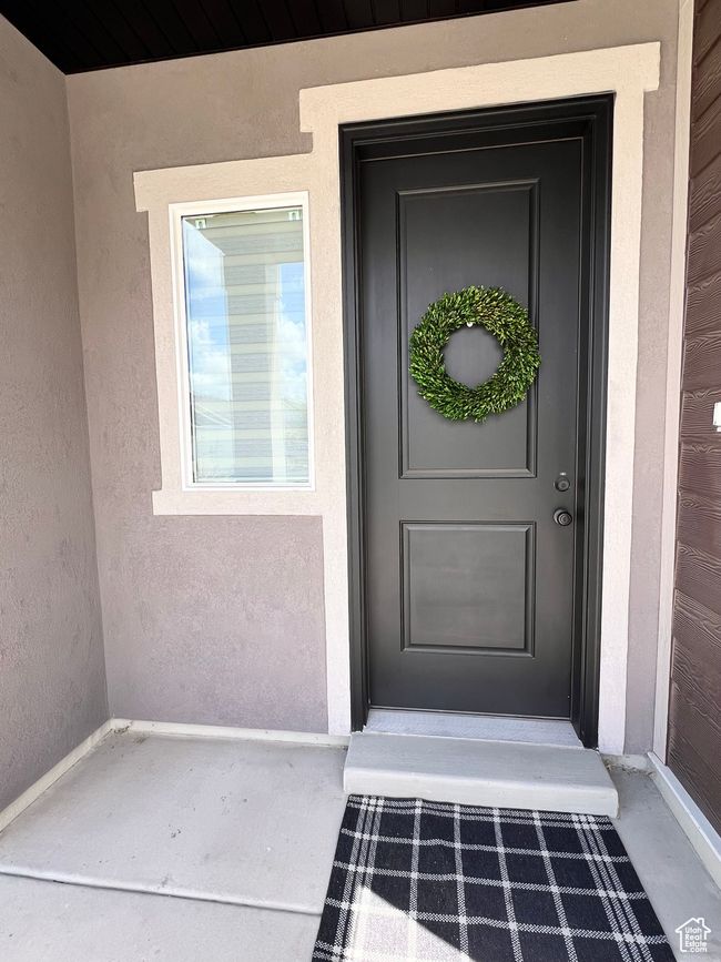 View of exterior entry featuring stucco siding | Image 24