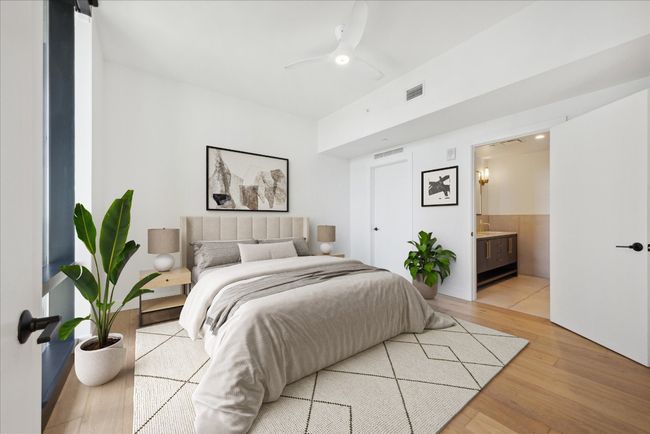 Bedroom featuring light wood-style flooring, ensuite bathroom, and a ceiling fan | Image 12