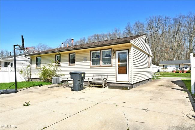 Back of house with fence, a patio area, a shingled roof, and central AC unit | Image 5
