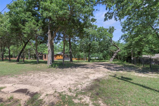 view of side of home from add'l lot owned by seller | Image 33