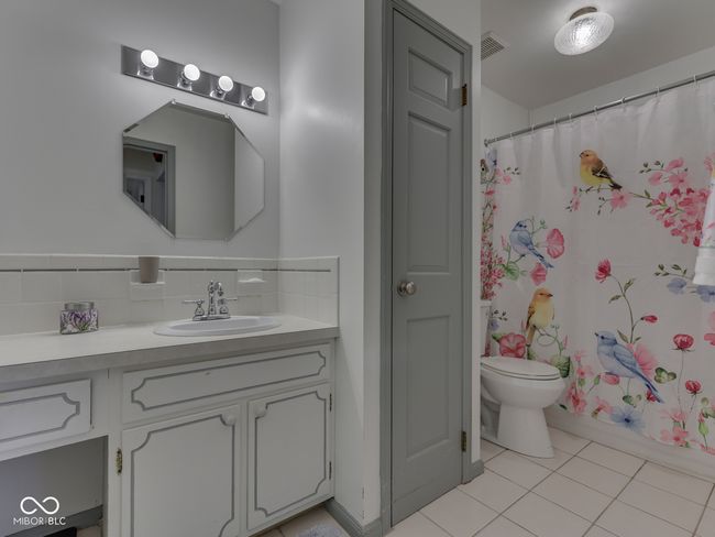 Full bathroom has a shower/tub combo, great vanity space in addition to the linen closet | Image 26