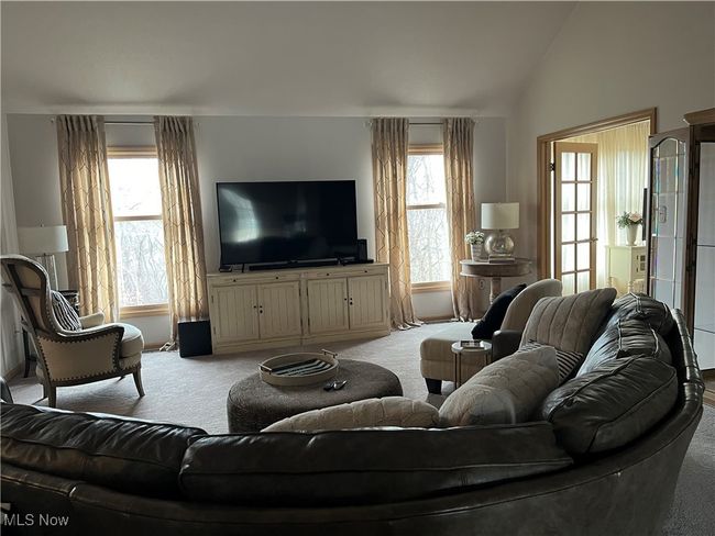 Carpeted Great Room featuring vaulted ceiling and plenty of natural light | Image 10