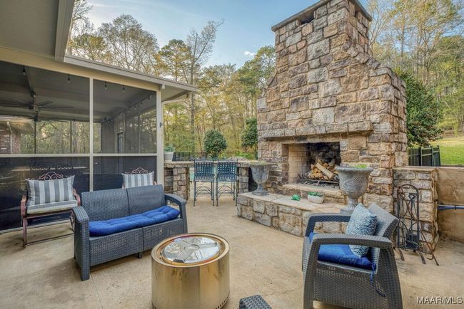 Perfect for chilly evenings - Outside stone fireplace with a firewood storage box. | Image 62