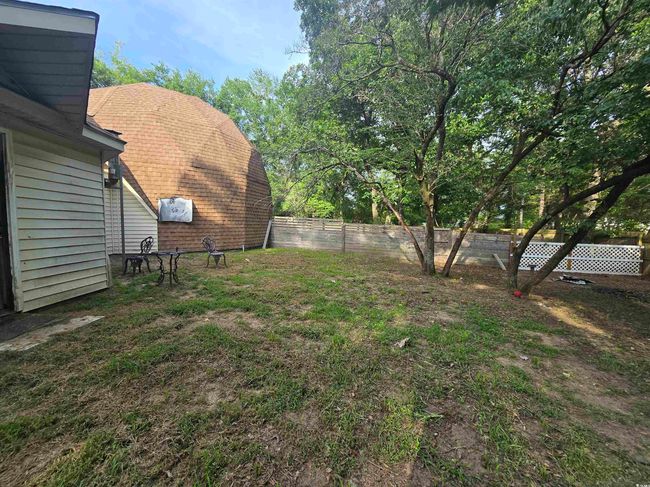 One of two fenced in private yard spaces. Front portion of the home. | Image 4