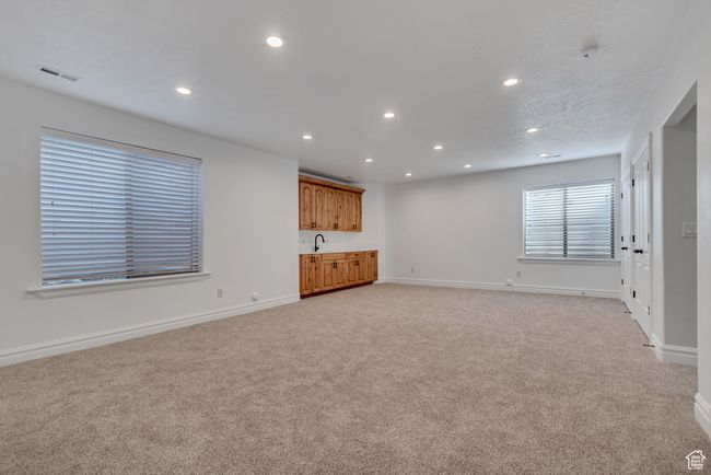 Unfurnished living room featuring recessed lighting and light carpet | Image 29