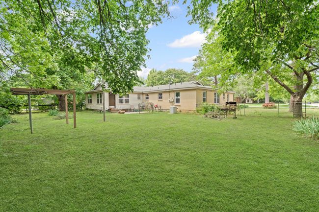 View of yard featuring a pergola and a patio | Image 34