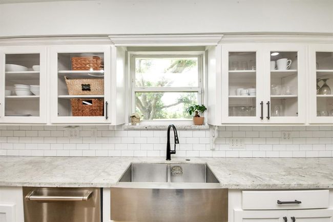 Deep double farmhouse sink set beneath a bright window—offering classic style, modern function, and a serene view while you wash up. | Image 14