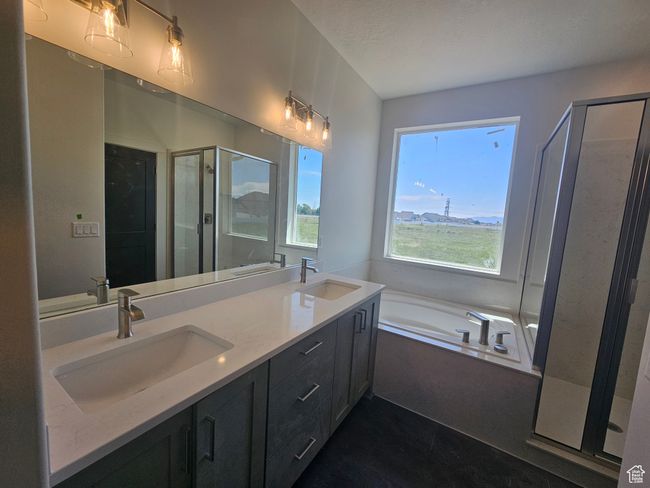 Full bathroom with a stall shower, a garden tub, double vanity, and tile patterned flooring | Image 21