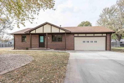 Ranch-style house with a garage | Image 1