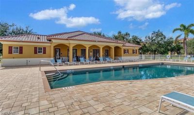 View of swimming pool featuring a patio | Image 1