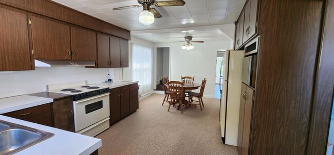 Kitchen and dining area | Image 4