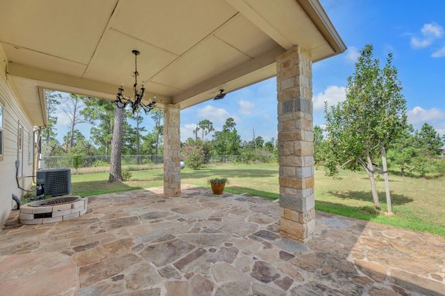 View of patio / terrace with a fire pit | Image 4