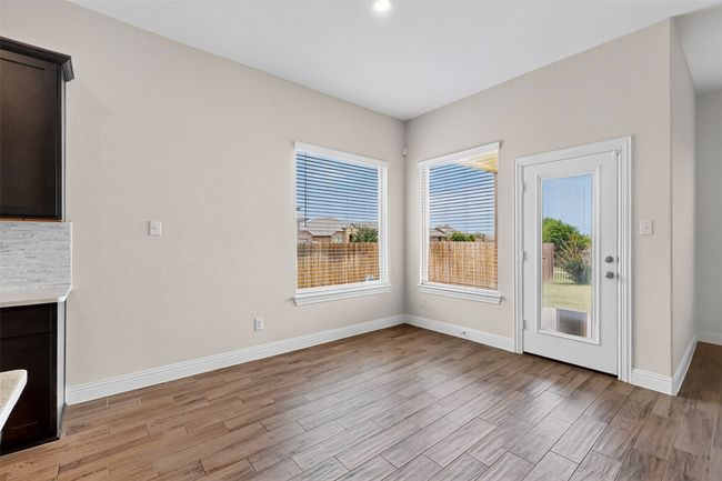 Unfurnished living room with light wood-style floors and baseboards | Image 15