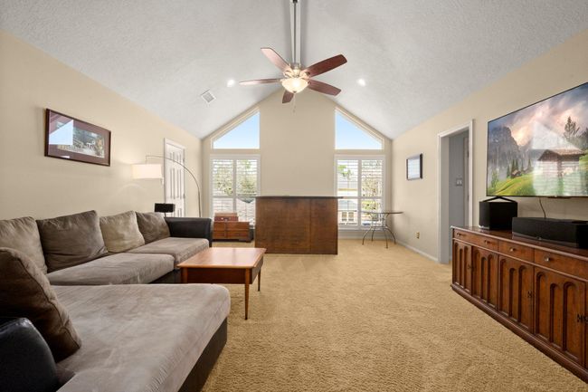Game room is ready for your movie nights. You'll appreciate the vaulted ceilings and huge storage closet. The hall to the right enters Bathroom 3. Bar is excluded. | Image 24