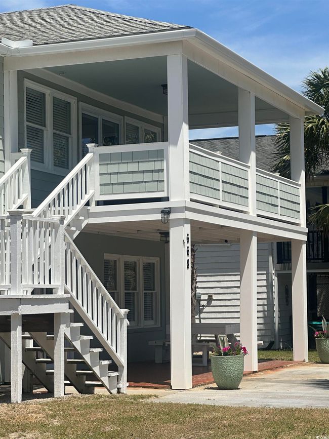 Exterior space featuring stairs and a shingled roof | Image 33