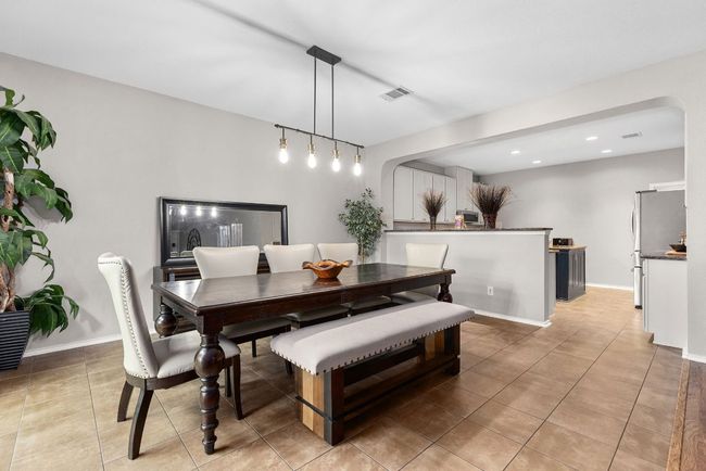 Dining area featuring light tile patterned floors, recessed lighting, and baseboards | Image 13