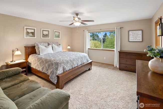 The primary suite is a spacious retreat with greenbelt & territorial views! | Image 12