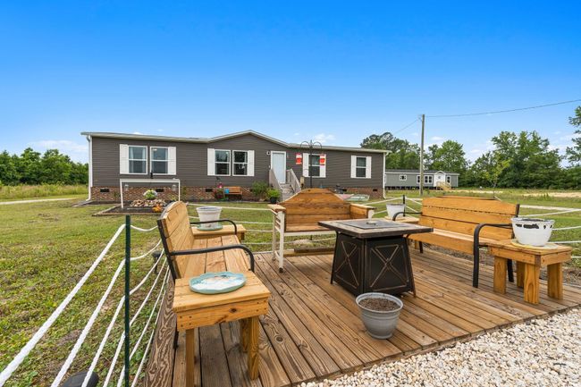 Wooden deck with a lawn | Image 4