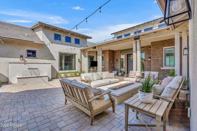 Private front courtyard with serene limestone water feature and gas firepit | Image 3