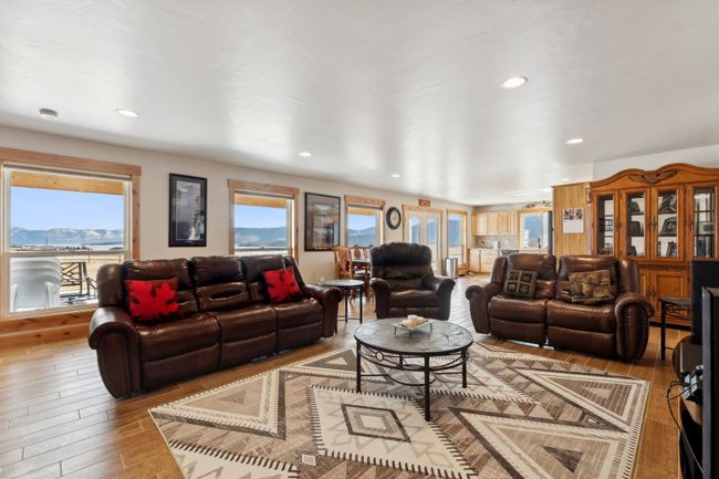 Living room featuring light wood-type flooring and a mountain view | Image 33