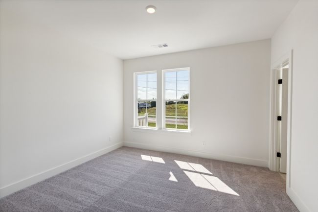 Nine-foot ceilings allow us to put bigger windows into your home. You can simply enjoy the additional natural light they provide! Actual photo of home. | Image 28