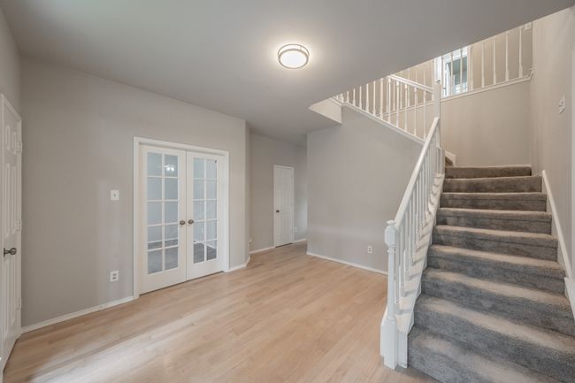 Entryway of home with space for sitting area. | Image 5