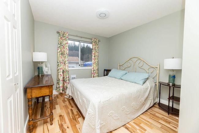 Bedroom featuring wood finished floors | Image 14