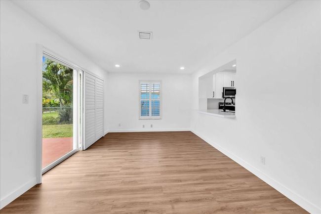with Pass-Through Bar to Kitchen & Slider to Back Yard | Image 17
