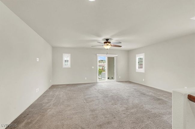 Unfurnished room featuring healthy amount of natural light, light colored carpet, and ceiling fan | Image 39